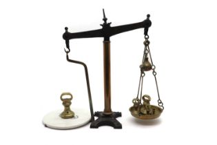 A set of brass and black painted cast iron beam scales,