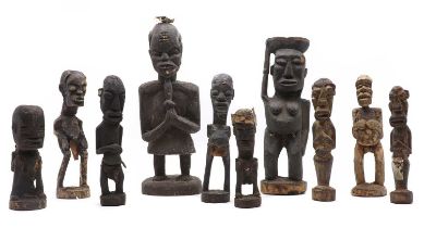 A group of nine carved wood figures