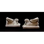 A pair of porcelain sea horses
