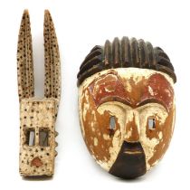 Two carved West African masks