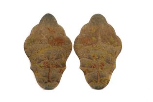 A pair of shaped needlework panels
