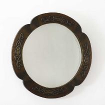 An Art Nouveau brass repoussé mirror,