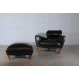 An 'Aston' armchair and ottoman,