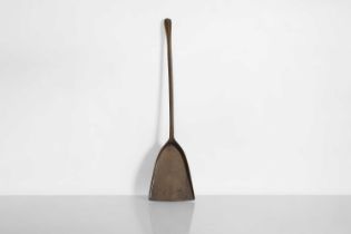 A rare patinated bronze fire shovel,