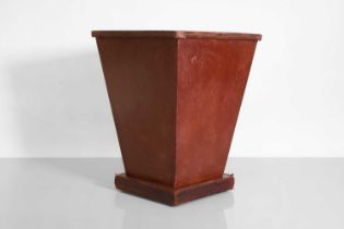 A leather wastepaper basket,