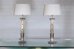 A pair of Art Deco-style bronze and brass table lamps,