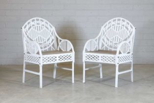 A pair of cast iron garden chairs,