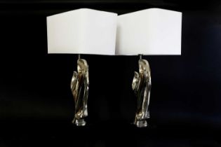 A pair of chrome table lamps in the style of Alain Chervet,