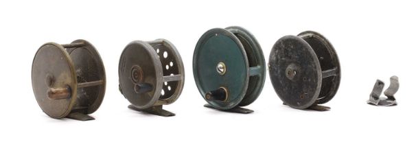 A group of four fly fishing reels