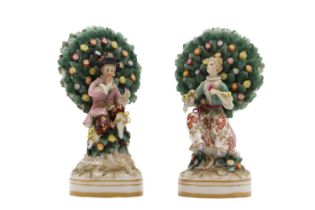 A pair of Chelsea-style porcelain bocage figures