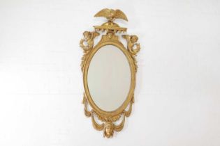 A giltwood oval wall mirror,