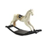 A painted wood rocking horse