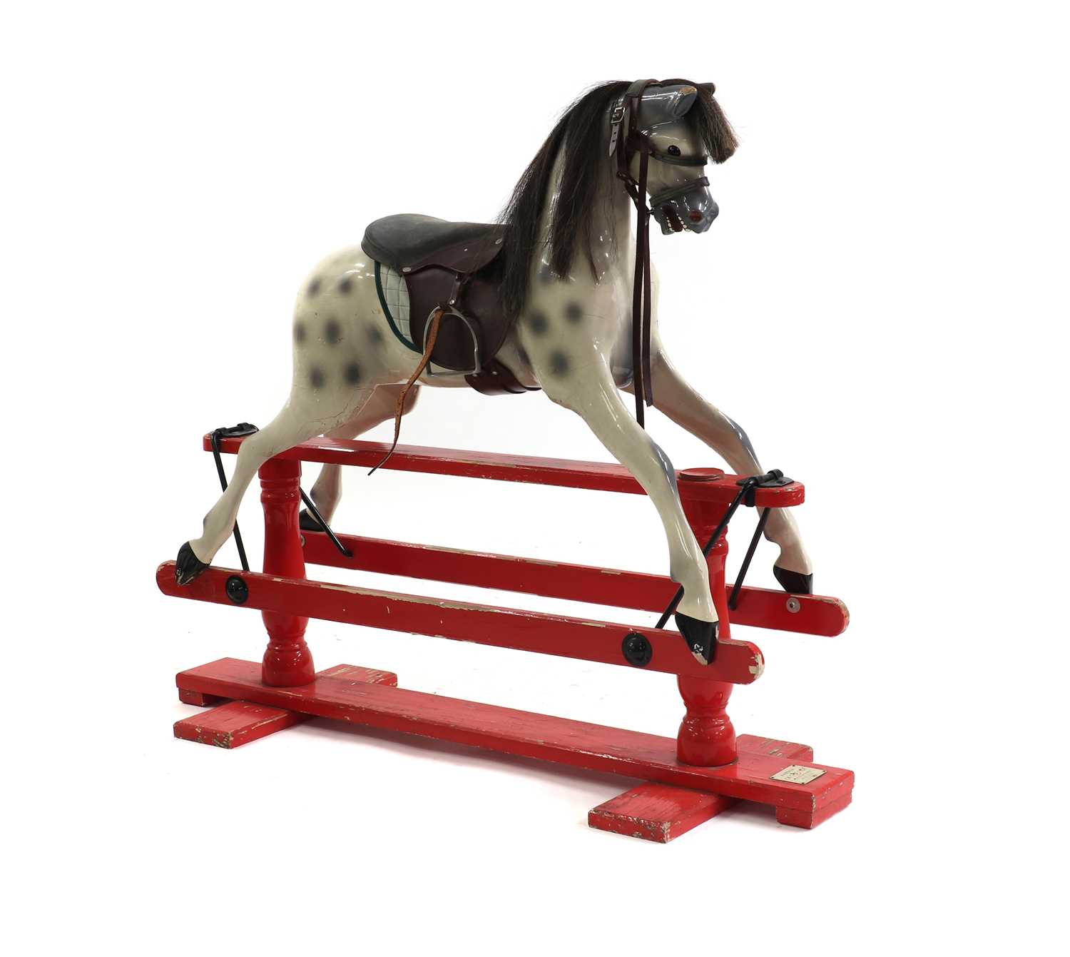 A painted wood rocking horse