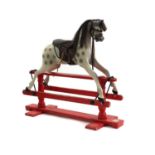 A painted wood rocking horse