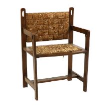 An Arts & Crafts oak elbow chair