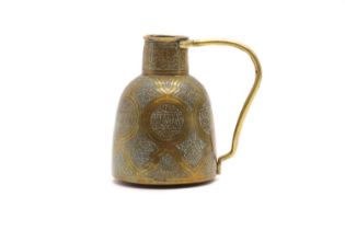 An Islamic brass jug
