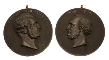 A pair of Bois Durci 'Bulls Blood' portrait medallions