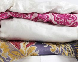 A group of silk embroidered textiles