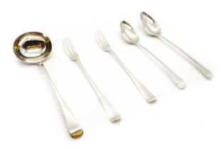 A group of silver serving flatware