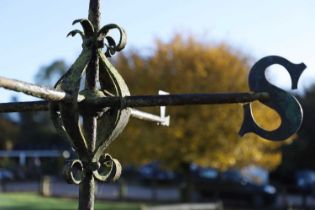 A wrought-iron and brass weather vane,