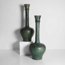 A pair of glazed earthenware vases,