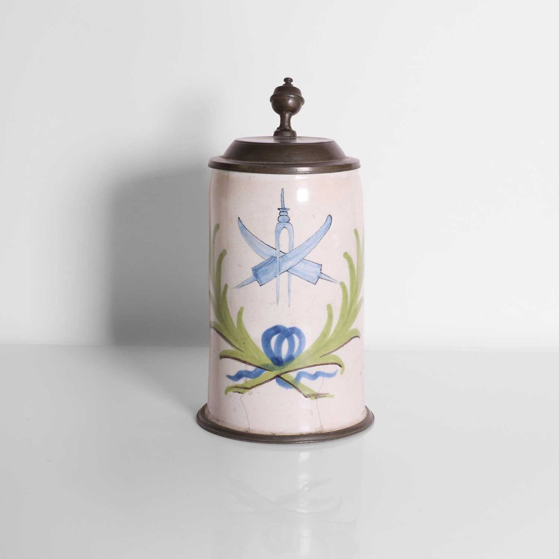A cutler's pewter-mounted delft tankard,