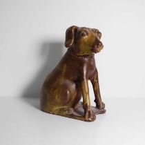 A glazed earthenware model of a dog,