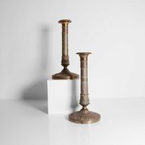 A pair of gilt-brass candlesticks from the Queen Mother's Marlborough House residence,