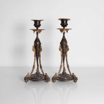 A pair of Aesthetic Period bronze candlesticks,