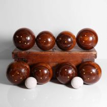 A set of lignum vitae lawn bowls,