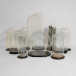 A group of ten Victorian glass domes,