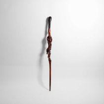 A carved folk art walking stick,