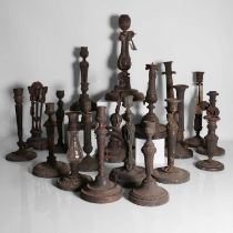 A collection of bronze, ormolu and glass candlesticks,