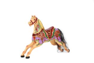 A carved wooden fairground carousel juvenile 'Dobby' horse attributed to F Heyn,