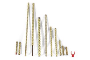 Eleven various lengths of fairground barley-twist brass poles,