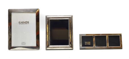 A group of three silver photograph frames