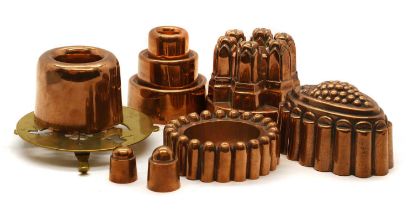 A collection of copper jelly moulds