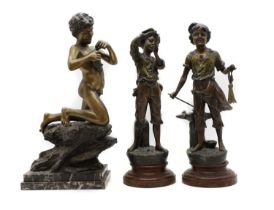 A group of three spelter figures