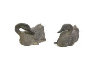 A pair of bronze garden ducks,