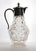 A silver mounted cut-glass claret jug,