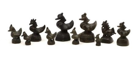 A group of ten bronze opium weights