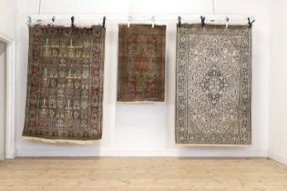 Three wool and silk rugs