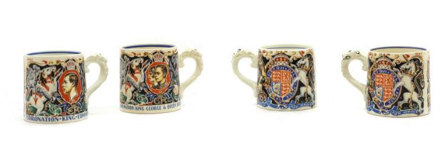 A group of four commemorative pottery mugs