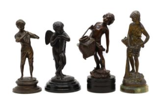 A group of four spelter figures