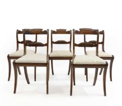 A set of five Regency mahogany and brass inlaid dining chairs,