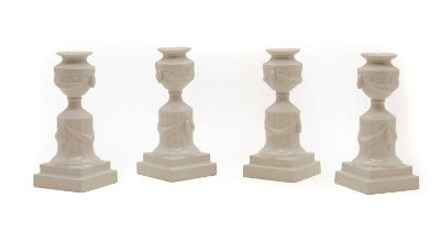 A set of four Royal Copenhagen porcelain candlesticks