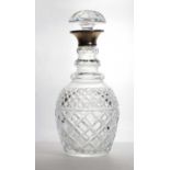 A silver mounted cut-glass decanter,