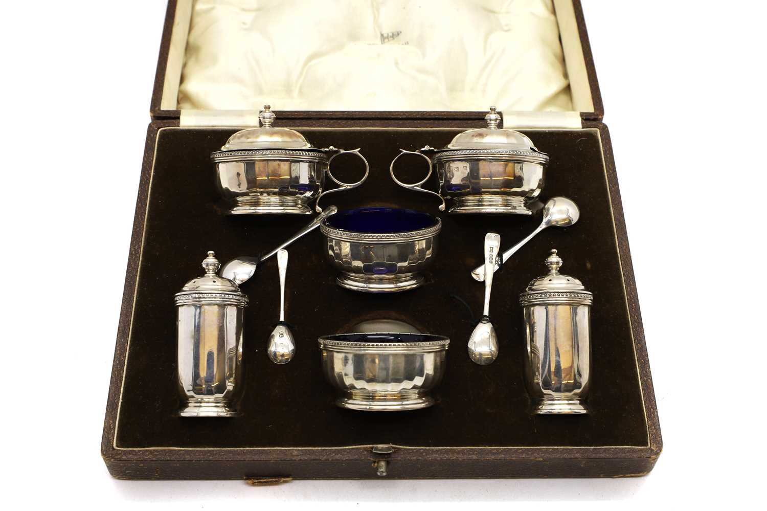 A cased set of silver cruets,