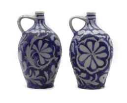A pair of Westerwald style German salt glazed jugs