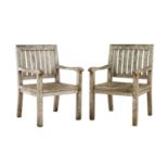 A pair of teak garden chairs,